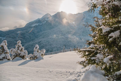 Scenic view of snow covered mountains against sky