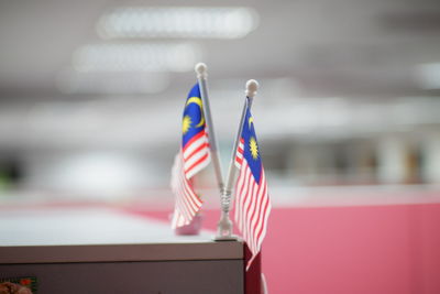 Close-up of flags against blurred background