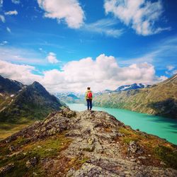 Rear view of woman standing on mountain