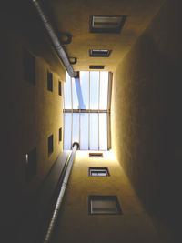 Low angle view of empty corridor in building