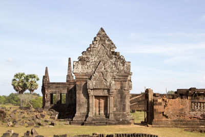 Old temple building against sky