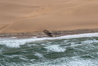 A rusty shipwreck on the skeleton coast, namibia