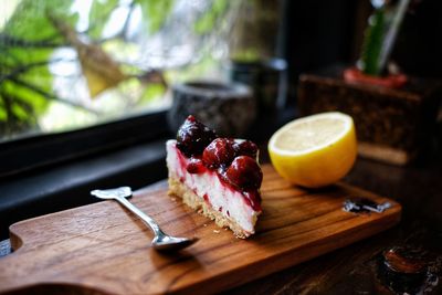 Dessert on serving board by window