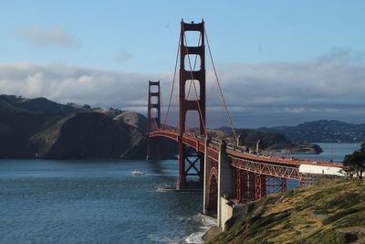 Golden gate bridge over sea against sky