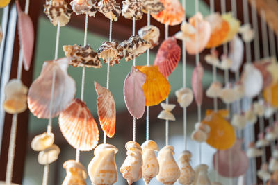 Close-up of decorations hanging for sale in market