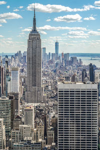 Buildings in city against sky