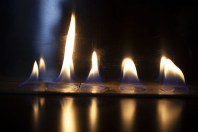 Close-up of burning candles