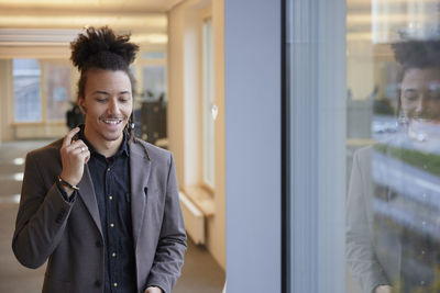 Smiling man standing in office