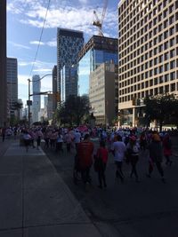 People walking on road in city