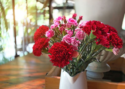 Close-up of red flower pot on table