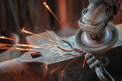 Close-up of rusty machine part in factory