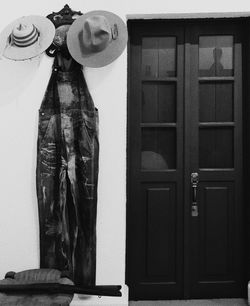 Midsection of woman standing by door at home