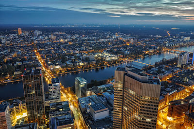 High angle view of illuminated buildings in city at night