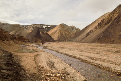 Creek in highland valley landscape photo