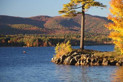 View of calm lake against mountain range