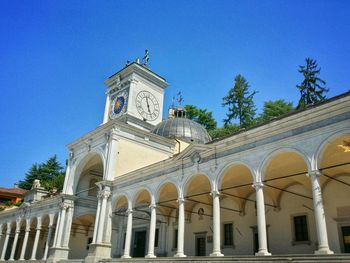 Low angle view of built structure against clear blue sky