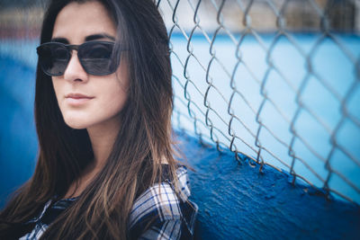 Portrait of young woman in sunglasses