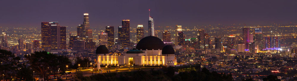 Illuminated buildings in city at night