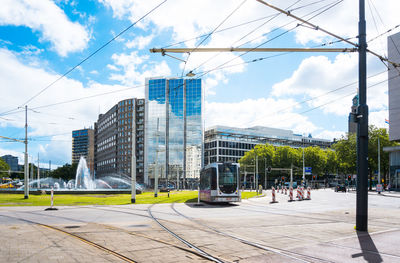 Tramway at street in city on sunny day