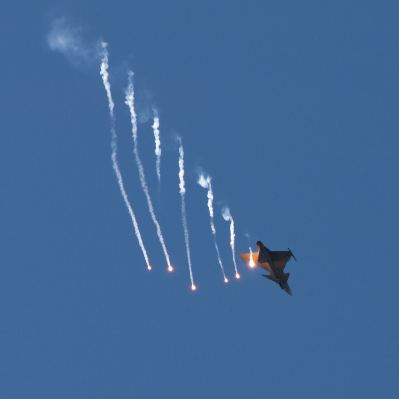 LOW ANGLE VIEW OF AIRPLANE FLYING IN SKY