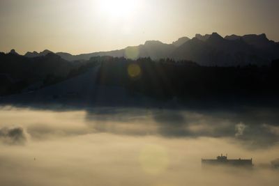 Scenic view of mountains against sky during sunset