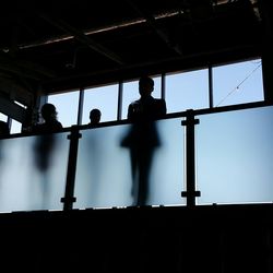 Low angle view of silhouette trees against sky