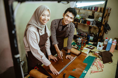 Portrait of young woman working at office