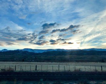 Scenic view of landscape against sky during sunset
