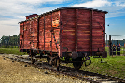 Train on railroad track against sky