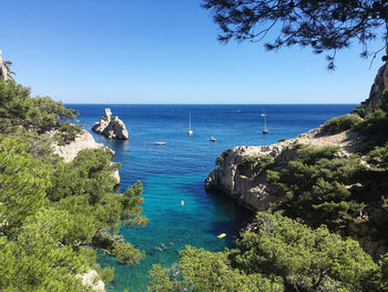 Scenic view of sea against clear blue sky