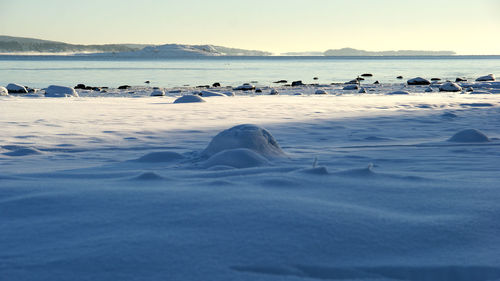 Scenic view of sea with mountains in background