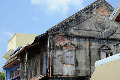 Low angle view of old building against sky