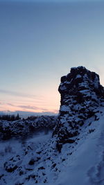 Scenic view of snow covered mountain against sky