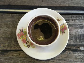 High angle view of coffee cup on table