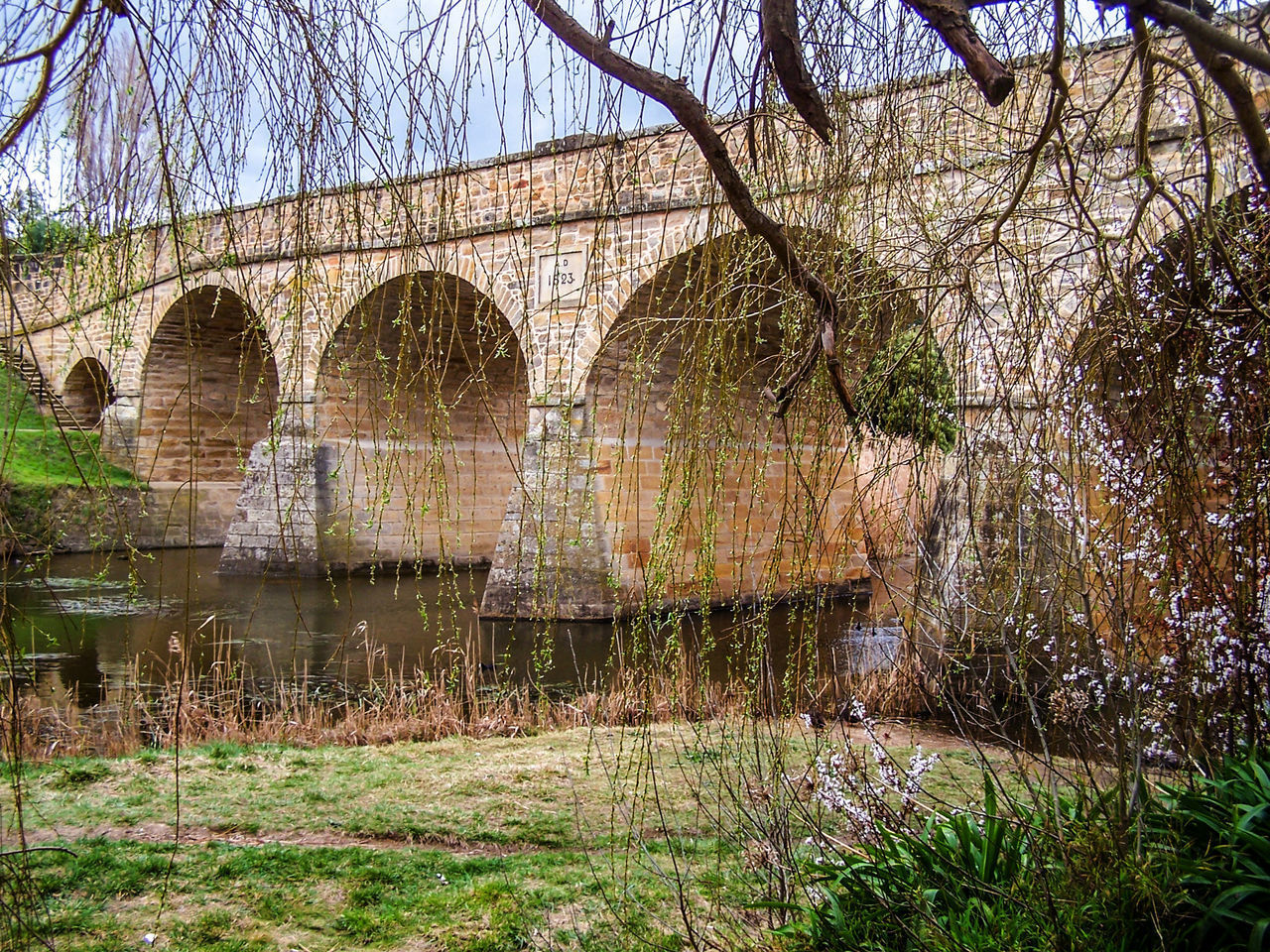 ARCH BRIDGE BY RIVER