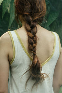 Rear view of woman with braided hair