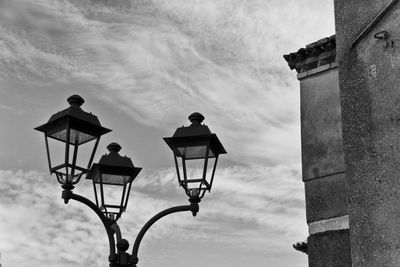 Low angle view of street light against sky