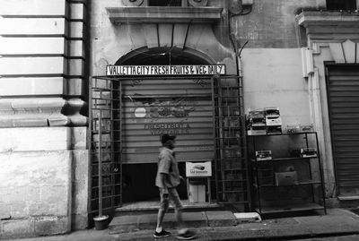 Woman standing in front of building