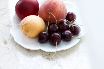High angle view of fruits in plate on table