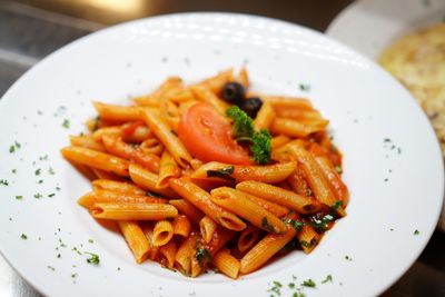 Close-up of noodles served in plate on table