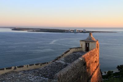 Scenic view of sea against clear sky during sunset