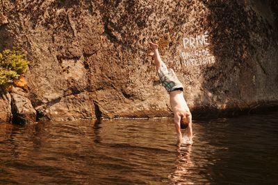 Man swimming in river