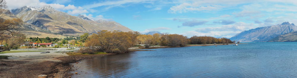 Scenic view of mountains and lake against sky