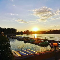 Scenic view of river against sky during sunset