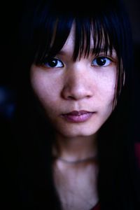 Portrait of young woman with bangs