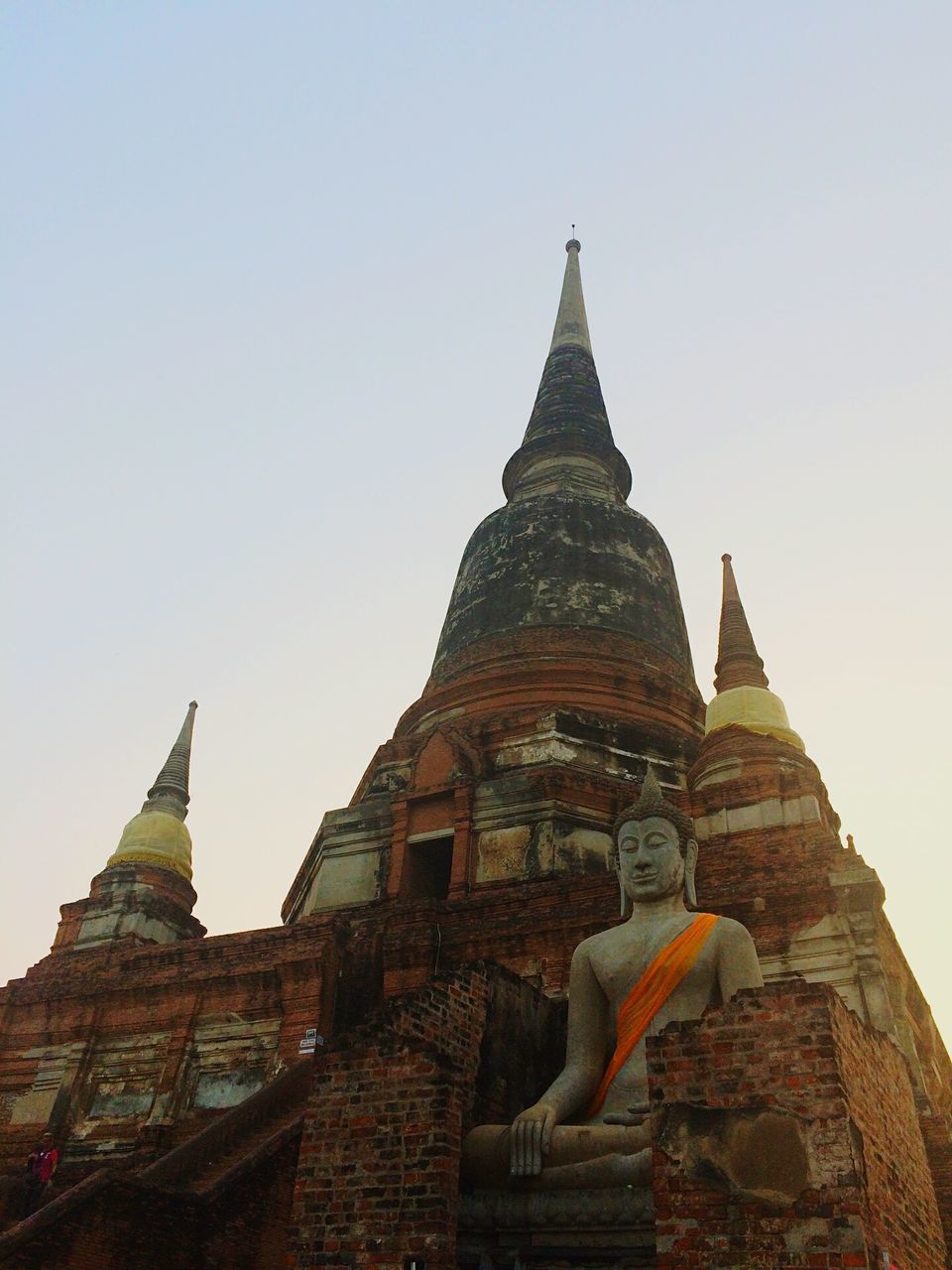 religion, spirituality, place of worship, temple - building, famous place, architecture, travel destinations, travel, tourism, built structure, building exterior, low angle view, clear sky, international landmark, history, ancient, stupa, temple