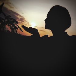 Portrait of silhouette woman against sky during sunset