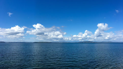 Scenic view of sea against blue sky