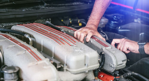 Mechanic repairing car engine