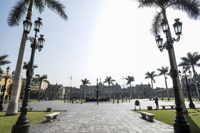 Panoramic view of people on street against sky